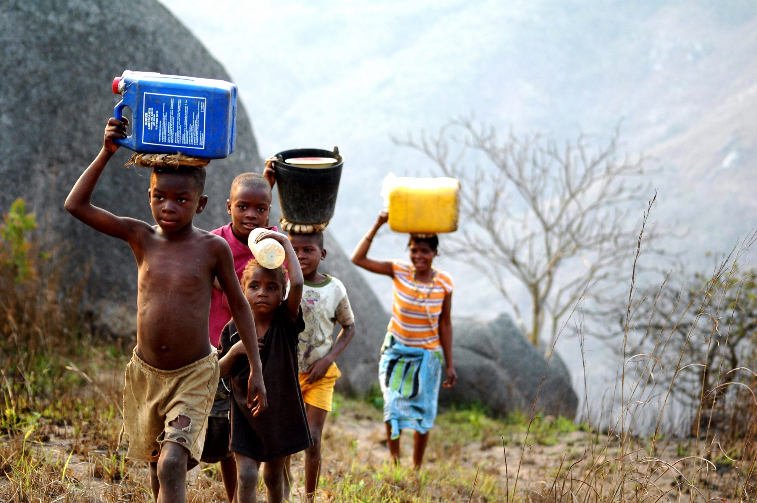 Ndalatando,,Angola,,2012,,Family,Carrying,Jerry,Cans,In Humanium