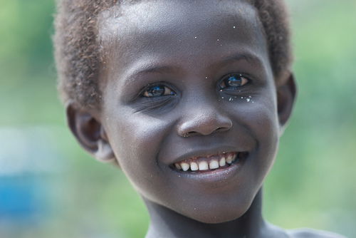 One of the kids jumping in front of my camera in Lilisiana, Solomon Island  people, Solomon Islands